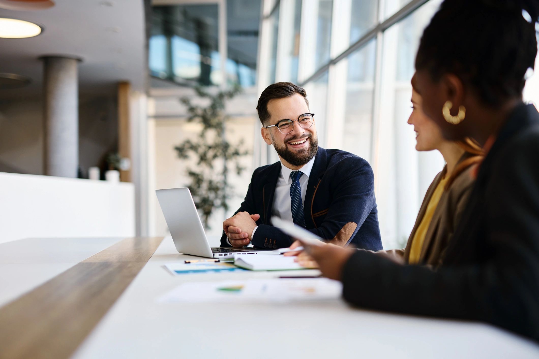 Consultants reviewing strategy and financial documents in an office